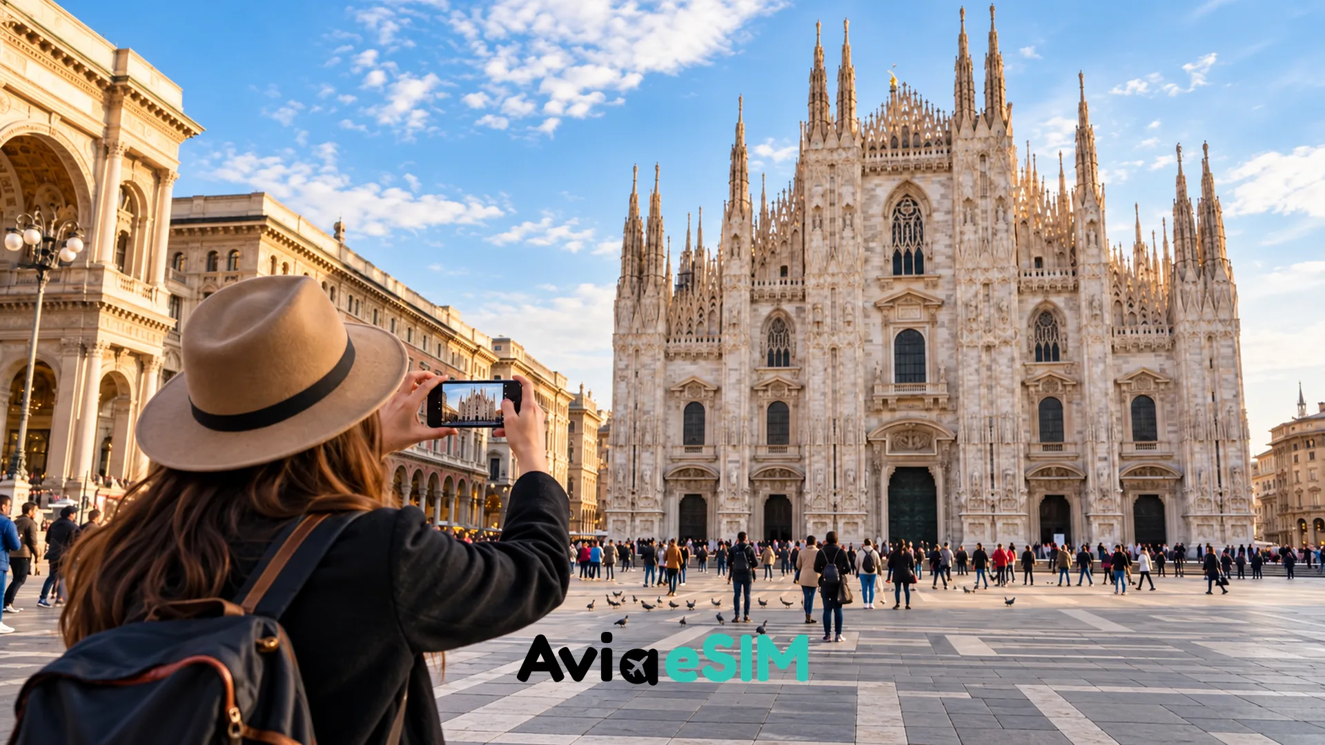 Traveler using a phone near Milan Cathedral in Piazza del Duomo